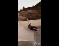 Black helmet guy falls off skateboard skatepark 