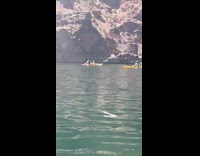 Guy does karaoke in middle of beach