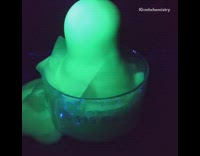 Chemistry flask with green substance poured chemicals bubbles
