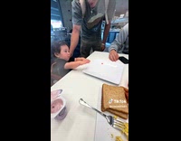 Kid plays with teammates of his father