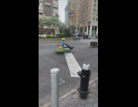 People riding down street on lawn chairs wearing mario kart outfits 