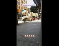 Two women photo shoot with soldiers sidewalk