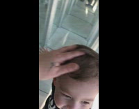 Little boy walks through mirror maze and bumps head onto glass