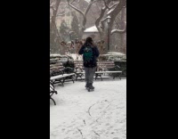 Man wear rollerblades walk on snow park