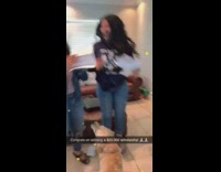 Dog jumping and celebrating with two girls reading letter