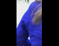 Girl black pants squat down street church