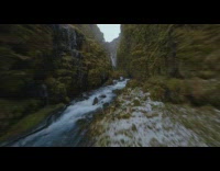 Aerial drone video of a narrow waterfalls