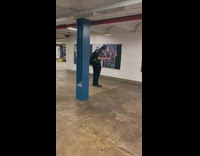 Man play recorder in front of advertisement