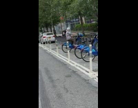 Old woman pedals backwards on citi bike