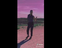 Bartier cardi challenge guy dances in field