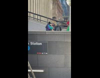 Group of people wearing xmas themed outfits outside subway