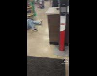 Friend pulls other friend to floor as prank at store