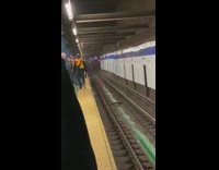 Green liquid water on subway train tracks
