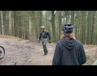 Biker attempts jump in mountain track but loses bike at jump