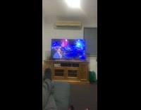 Guy watches american ninja warriors eats KFC 