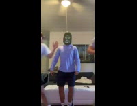 Guys dressed as different ricks and morty dancing in living room in line