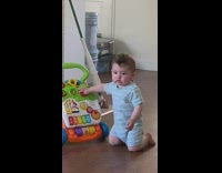 Baby kneel on floor poop in diaper