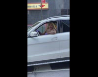 Woman drives and sings to rap song 