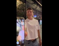 Guy shows smartphone camera pointing at him