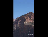 Guy pees red rock canyon cliff boots