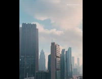 Time lapse clouds pass high rise buildings 