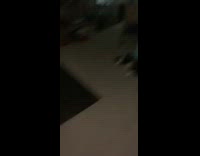 Kid blue shorts jumps on two pillows 