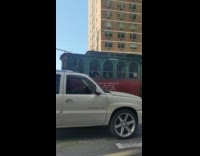 Guy sticks butt out window moving trolley 
