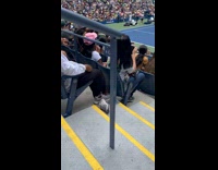 Woman watch tennis game with her shoes off