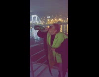blonde girl on boat pops champagne bottle and drinks