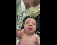 Lady Lifts and Shows her Baby Struggle