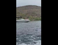 Woman on a yacht touched in the butt by a man photo shoot