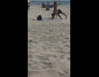 Guy yoga pose handstand orange bikini girl 