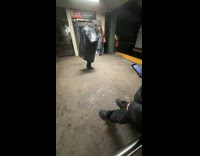 Man wear trash bag put head inside