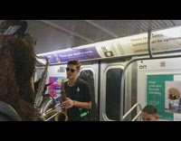 Pt. 2 Bigfoot costume blue bandana plays saxophone on the subway train passengers enter