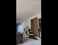 Black dog green toy girl lay down