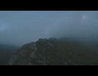 Drone video of the mountain hill covered with fog