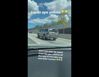 Car drives onto highway with gas station nozzle and hose still attached to car