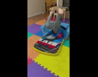 Little girl does scorpion on red ball 