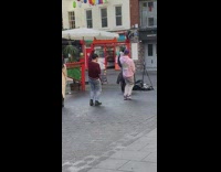 Two guys film tiktok dance in chinatown 