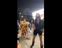 People wearing costume near food truck 
