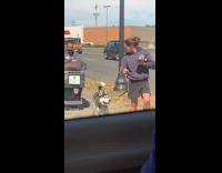 Lady hands over leash before spinning around pole