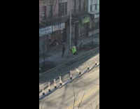 Lady yells at green germ costume sidewalk 