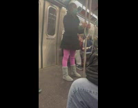 Girl holding pole bends down subway exercise 