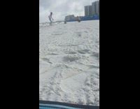 Girl tiktok dances at beach friend records 