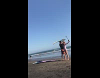 IITW - couple takes selfie with surf board