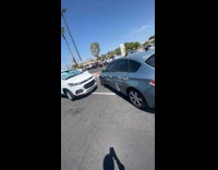 Man leaves car near badly parked car