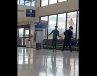 Guy and mom film tiktok airport luggage