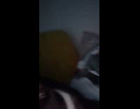 Woman trying to record while kitten attacks camera