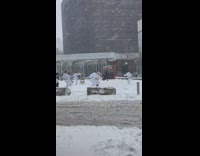 Martial arts class outdoors in snowstorm