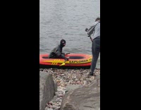 Girl robber mask ride boat shallow water